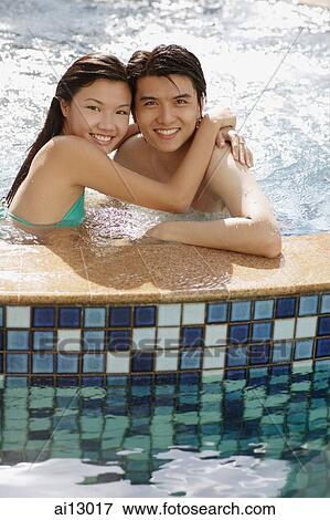 Couple in hot tub, looking at camera View Large Photo Image Stock Photo - Couple in hot tub, looking at camera. Fotosearch