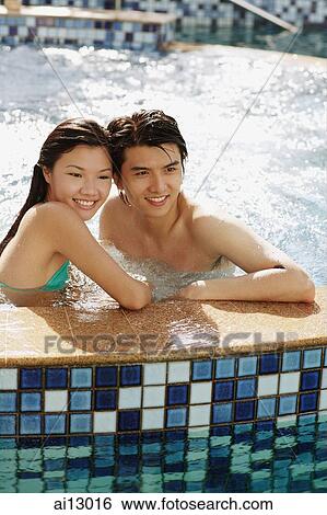 Couple in hot tub, looking away View Large Photo Image Stock Photograph - Couple in hot tub, looking away. Fotosearch