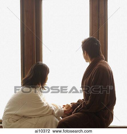 Couple in robes, looking at window View Large Photo Image Stock Image - Couple in robes, looking at window. Fotosearch