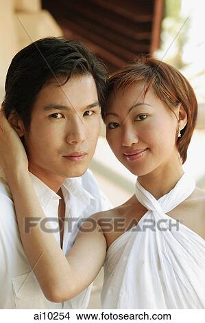 Picture - Couple looking at camera, portrait. Fotosearch