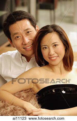 Couple looking at camera, portrait View Large Photo Image Stock Image - Couple looking at camera, portrait. Fotosearch