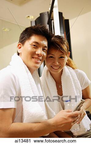 Couple looking at camera, portrait View Large Photo Image Stock Image - Couple looking at camera, portrait. Fotosearch
