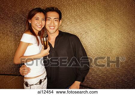 Couple looking at camera smiling View Large Photo Image Picture - Couple looking at camera smiling. Fotosearch