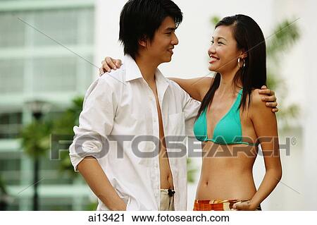 Couple looking at each other, embracing View Large Photo Image Stock Image - Couple looking at each other, embracing. Fotosearch