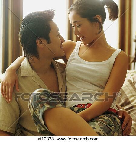 Couple looking at each other, home interior View Large Photo Image Stock Photo - Couple looking at each other, home interior. Fotosearch