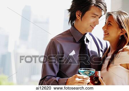 Couple looking at each other, portrait View Large Photo Image Stock Image - Couple looking at each other, portrait. Fotosearch