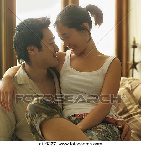 Couple looking at each other View Large Photo Image Stock Photo - Couple looking at each other. Fotosearch