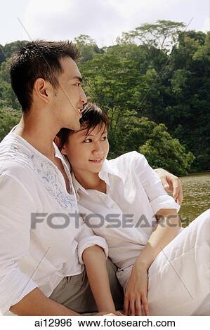 Couple looking away, portrait View Large Photo Image Stock Photograph - Couple looking away, portrait. Fotosearch
