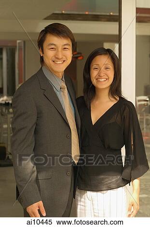 Stock Photography - Couple side by side, looking at camera, smiling. Fotosearch
