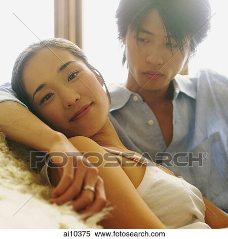 Couple sitting by a window, man looking at woman View Large Photo Image Stock Photography - Couple sitting by a window, man looking at woman. Fotosearch