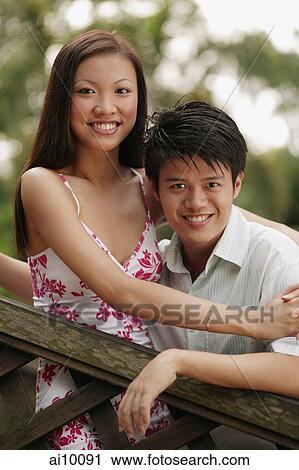 Couple smiling, looking at camera. View Large Photo Image Stock Image - Couple smiling, looking at camera.. Fotosearch