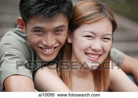 Couple smiling, looking at camera. View Large Photo Image Stock Photography - Couple smiling, looking at camera.. Fotosearch