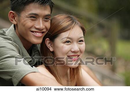 Couple smiling, looking away View Large Photo Image Picture - Couple smiling, looking away. Fotosearch