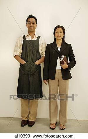 Couple standing side by side View Large Photo Image Stock Photo - Couple standing side by side. Fotosearch