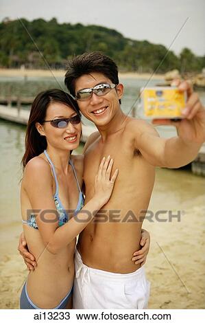 Couple taking a picture of themselves View Large Photo Image Stock Image - Couple taking a picture of themselves. Fotosearch