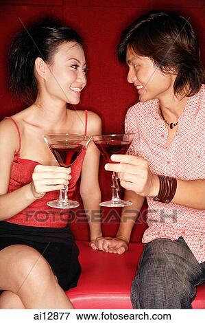 Couple toasting with drinks View Large Photo Image Stock Photo - Couple toasting with drinks. Fotosearch