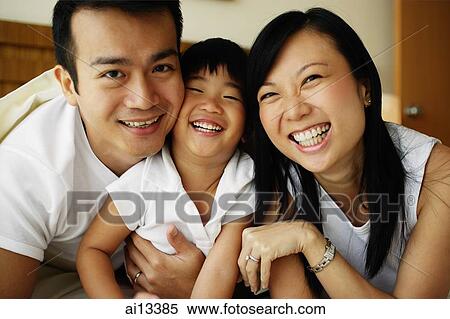 Couple with young daughter, portrait View Large Photo Image Stock Photography - Couple with young daughter, portrait. Fotosearch
