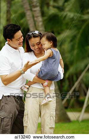 Stock Image - Couple with young daughter. Fotosearch