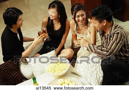 Couples at home toasting with champagne View Large Photo Image Stock Photography - Couples at home toasting with champagne. Fotosearch