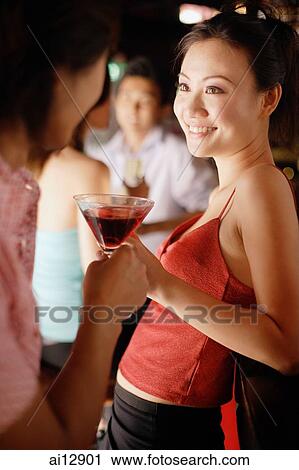 Couples at night club, toasting View Large Photo Image Stock Image - Couples at night club, toasting. Fotosearch