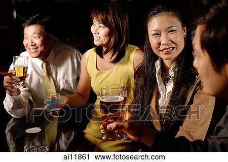 Couples drinking at bar View Large Photo Image Stock Image - Couples drinking at bar. Fotosearch