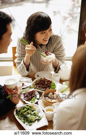 Couples eating at a Chinese restaurant View Large Photo Image Stock Photo - Couples eating at a Chinese restaurant. Fotosearch