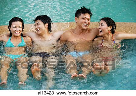Couples in swimming pool, sitting side by side View Large Photo Image Stock Photo - Couples in swimming pool, sitting side by side. Fotosearch