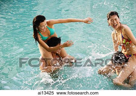 Couples in swimming pool, women sitting on men's shoulders View Large Photo Image Stock Photography - Couples in swimming pool, women sitting on men's shoulders. Fotosearch