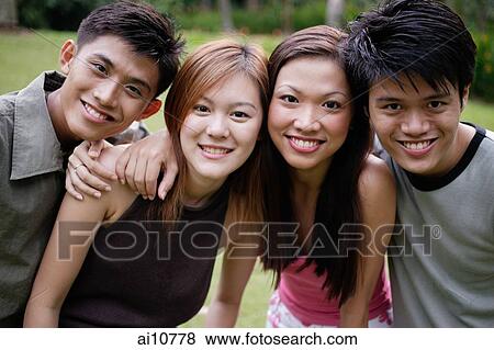 Couples looking at camera, portrait View Large Photo Image Stock Photo - Couples looking at camera, portrait. Fotosearch