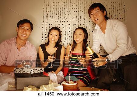Couples sitting down, looking at camera, women holding wine glass View Large Photo Image Stock Image - Couples sitting down, looking at camera, women holding wine glass. Fotosearch