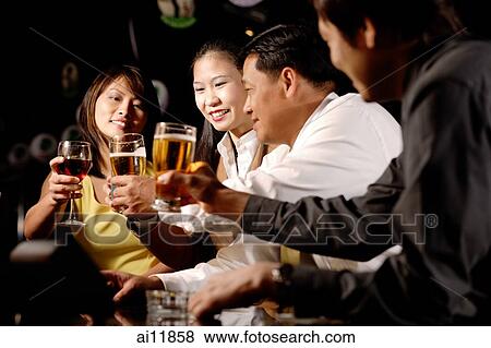Couples toasting with drinks View Large Photo Image Stock Photo - Couples toasting with drinks. Fotosearch
