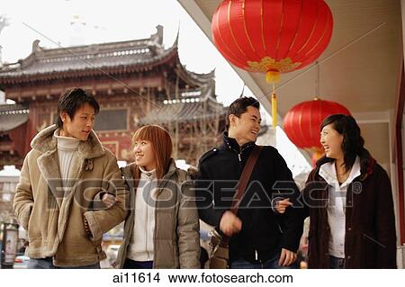 Couples walking arm in arm, smiling View Large Photo Image Picture - Couples walking arm in arm, smiling. Fotosearch