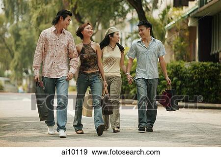 Couples walking hand in hand View Large Photo Image Stock Photo - Couples walking hand in hand. Fotosearch