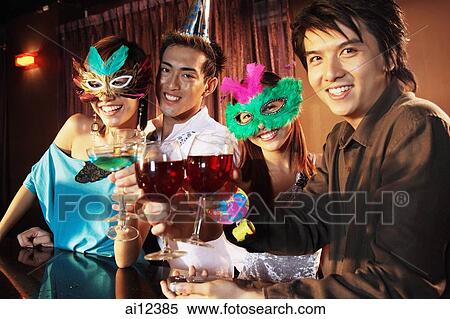 Couples with masks, holding drinks, looking at camera View Large Photo Image Stock Photography - Couples with masks, holding drinks, looking at camera. Fotosearch