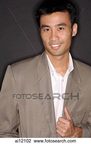 Executive looking at camera, portrait View Large Photo Image Stock Image - Executive looking at camera, portrait. Fotosearch