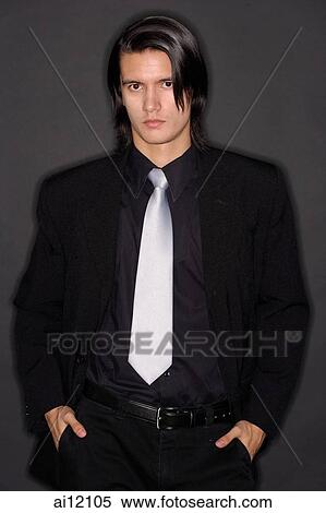 Stock Photography - Executive looking at camera, portrait. Fotosearch