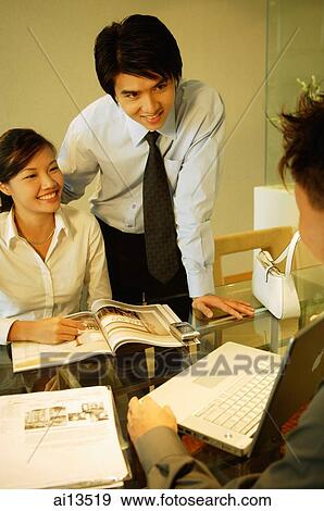 Executives having a discussion View Large Photo Image Stock Photo - Executives having a discussion. Fotosearch