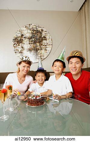 Family at home, celebrating a birthday View Large Photo Image Stock Image - Family at home, celebrating a birthday. Fotosearch