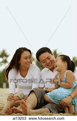 Family with one child, daughter laughing View Large Photo Image Stock Image - Family with one child, daughter laughing. Fotosearch