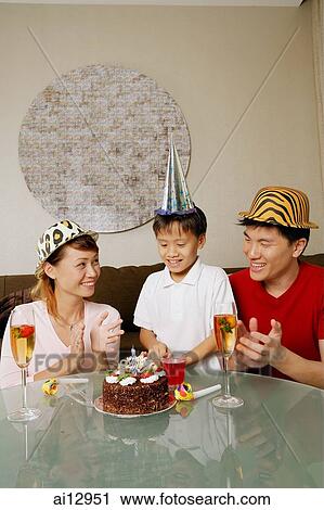 Family with one son, celebrating a birthday View Large Photo Image Stock Image - Family with one son, celebrating a birthday. Fotosearch