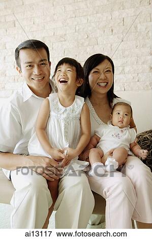Stock Photo - Family with two children, portrait. Fotosearch
