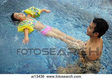 Father and daughter in swimming pool View Large Photo Image Stock Photograph - Father and daughter in swimming pool. Fotosearch