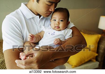 Father carrying baby daughter, portrait View Large Photo Image Stock Image - Father carrying baby daughter, portrait. Fotosearch