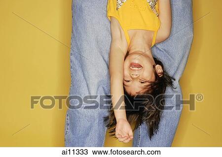 Father carrying daughter upside down. View Large Photo Image Stock Image - Father carrying daughter upside down.. Fotosearch