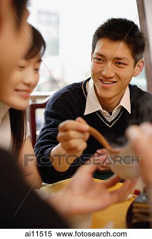 Friends eating at restaurant View Large Photo Image Stock Photography - Friends eating at restaurant. Fotosearch