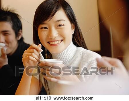 Friends eating soup, smiling View Large Photo Image Stock Image - Friends eating soup, smiling. Fotosearch