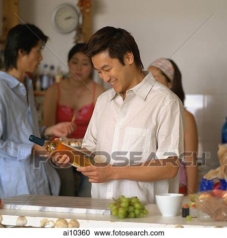 Friends in the kitchen, talking View Large Photo Image Stock Image - Friends in the kitchen, talking. Fotosearch