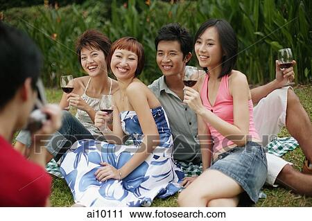 Friends posing for pictures View Large Photo Image Stock Image - Friends posing for pictures. Fotosearch
