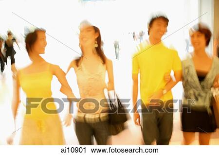 Friends walking side by side, arm in arm View Large Photo Image Stock Image - Friends walking side by side, arm in arm. Fotosearch