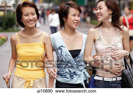 Friends walking side by side, talking View Large Photo Image Stock Image - Friends walking side by side, talking. Fotosearch